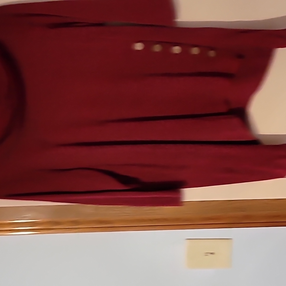 Maroon sweater with gentle black accents.
